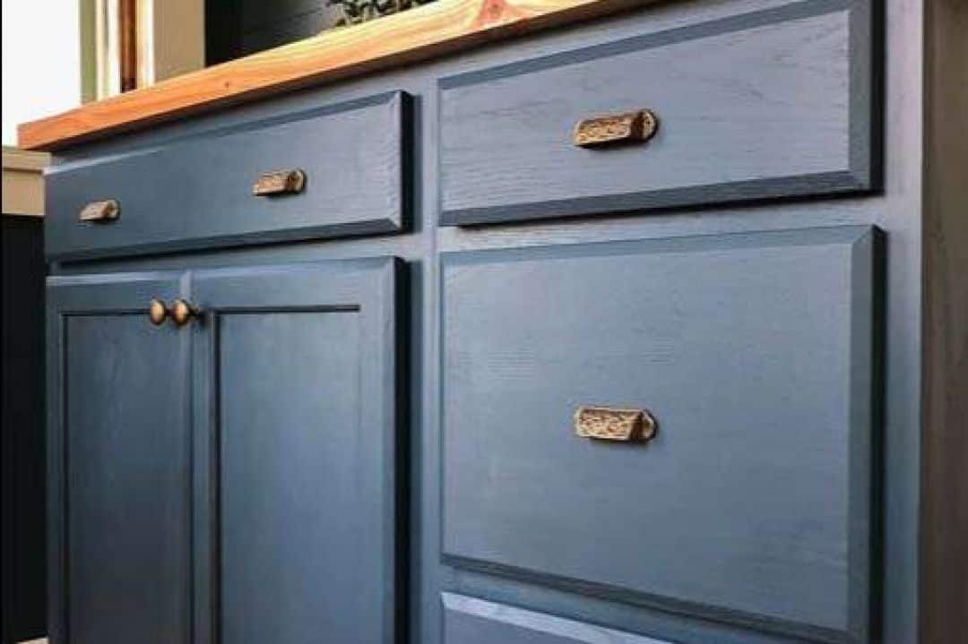 Bluish gray kitchen cabinets with a modern satin finish painted by Red Door Painting Pros in Tucson.