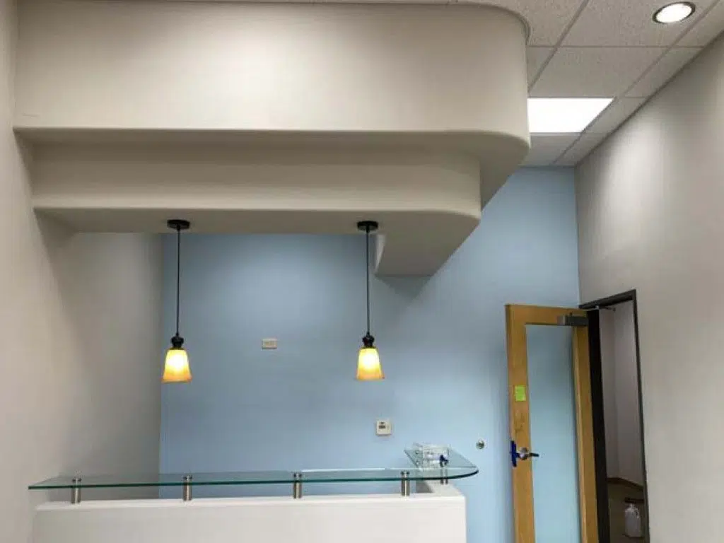 Commercial office desk area freshly painted with clean, modern colors and smooth, professional finishes in Tucson.