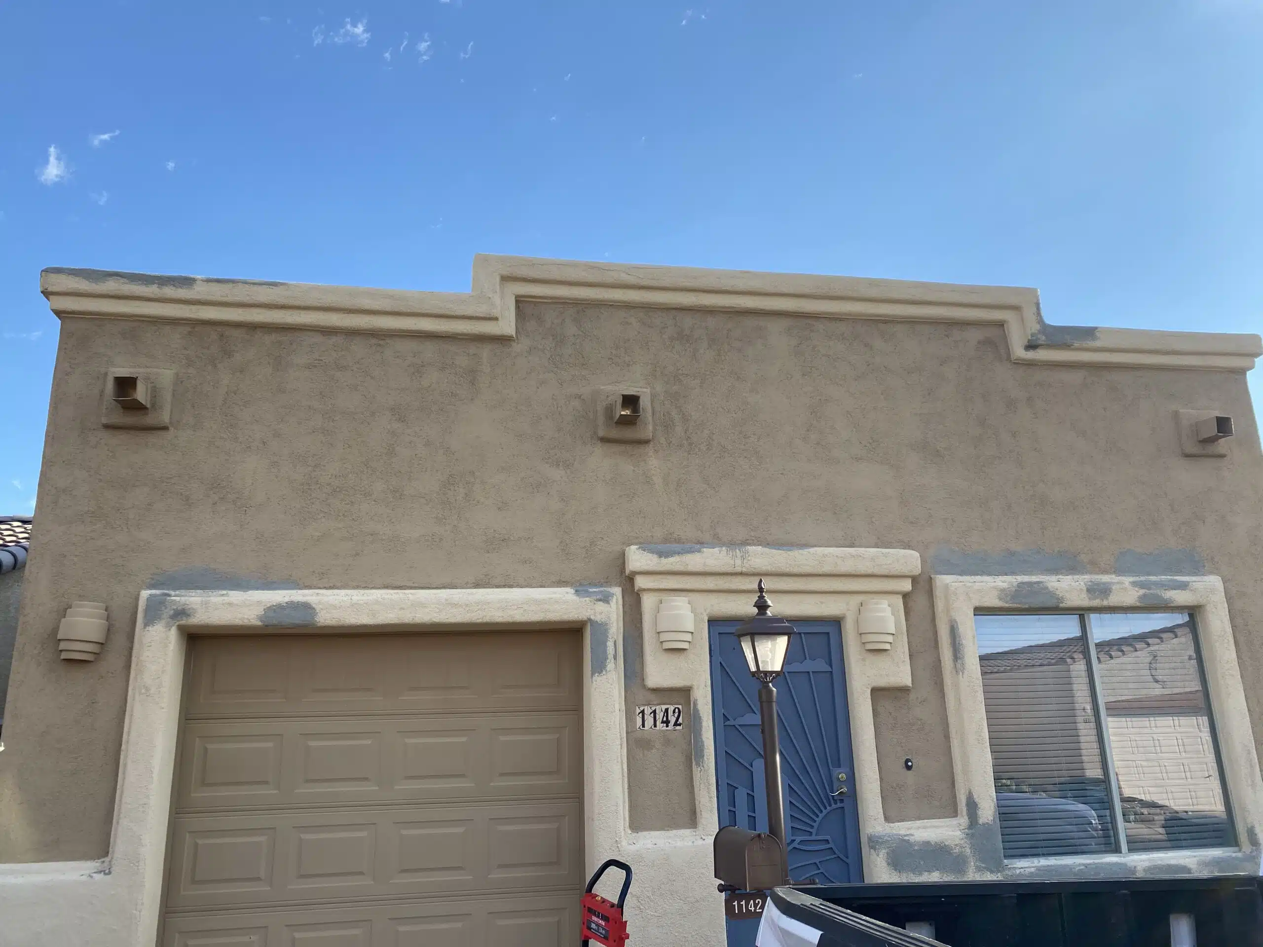 Photo Jul 07 2023, 6 56 53 AM Wood kitchen cabinets partially refinished to light gray, showing a before-and-after transformation by Red Door Painting Pros in Tucson.