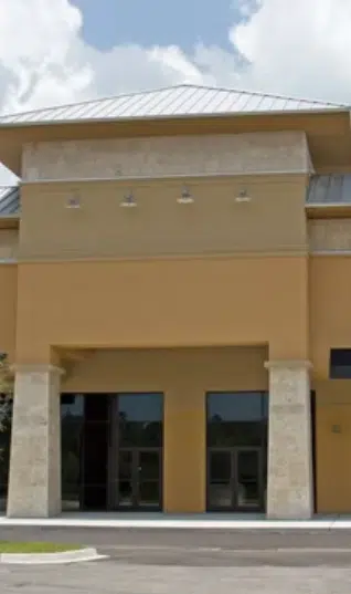 commercial-stucco-completed White kitchen cabinets with a smooth, professional painted finish by Red Door Painting Pros in Tucson.